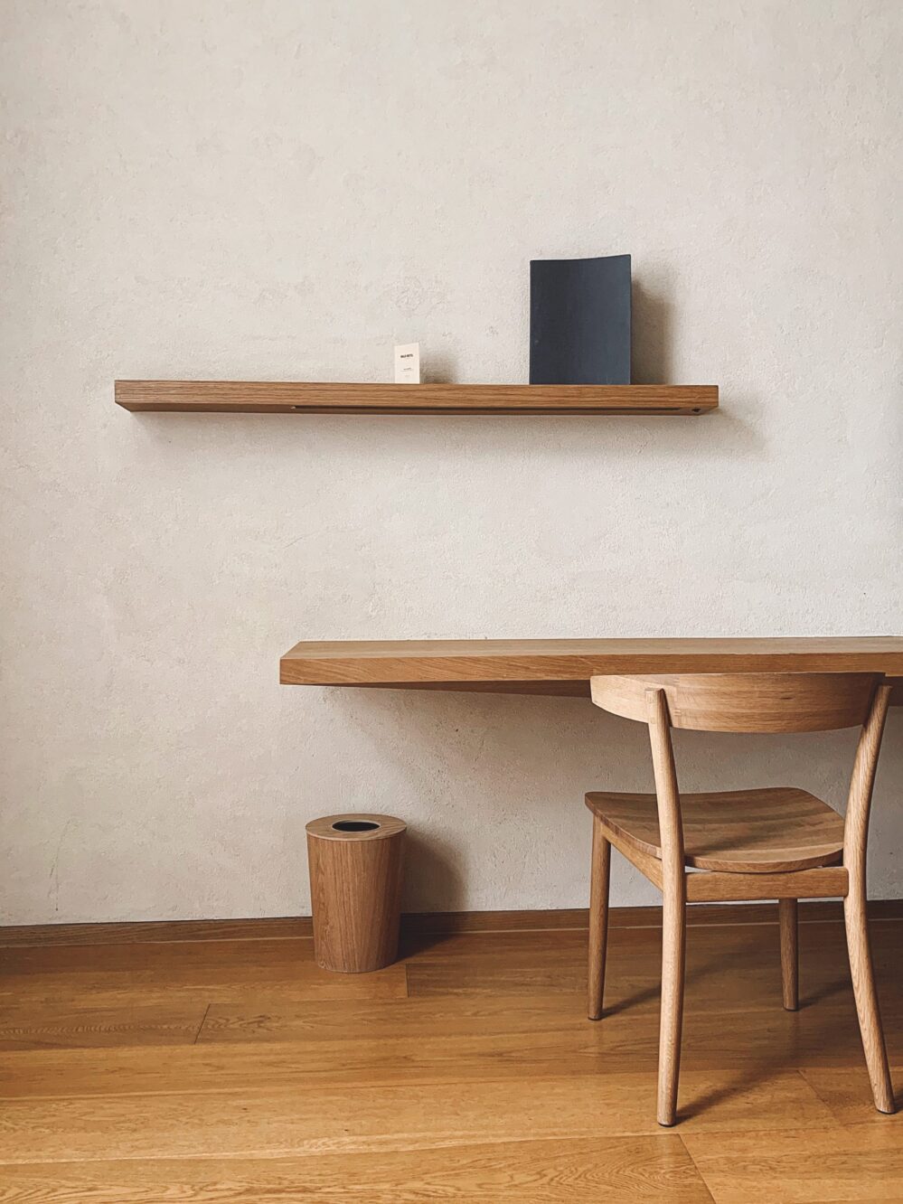 minimalistic side study area with wooden table and chair